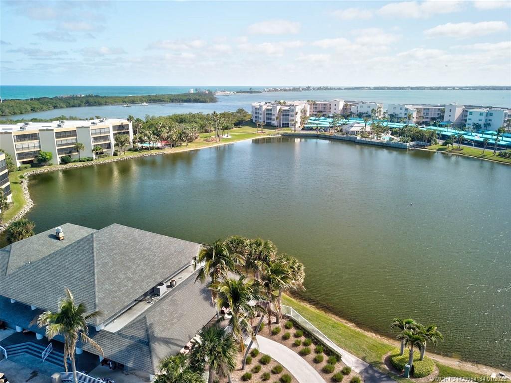 5700 Northeast Island Cove Way, Unit 4301 Stuart, FL 34996 - Photo 42 of 45 an aerial view of a house with a lake view