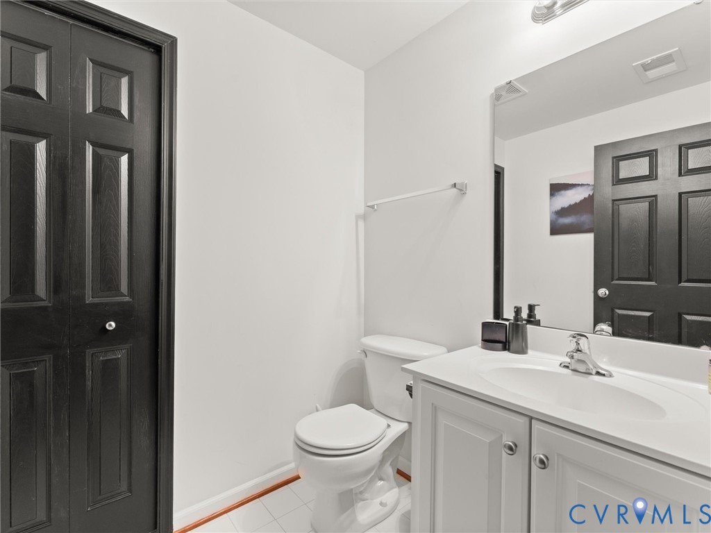 126 Reedy Creek Road Louisa, VA 23093 - Photo 29 of 68 The bathroom features a white vanity with an integ