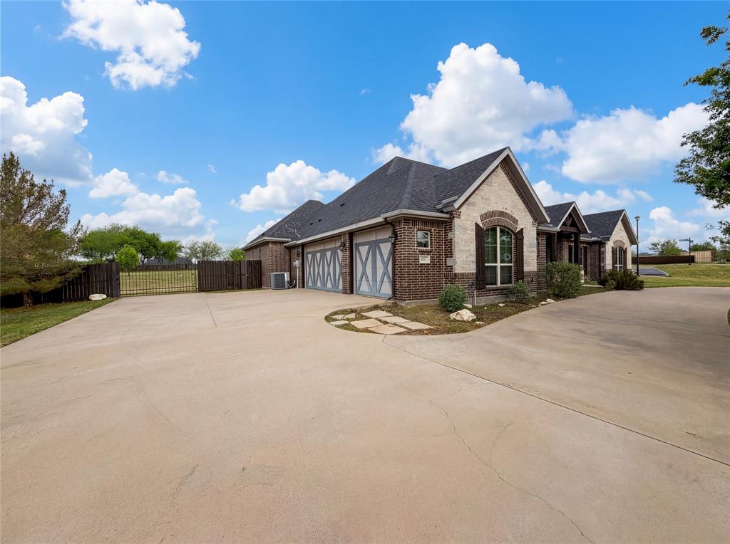 6411 Caliche Circle Midlothian, TX 76065 - Photo 1 of 26 a view of a house with a yard