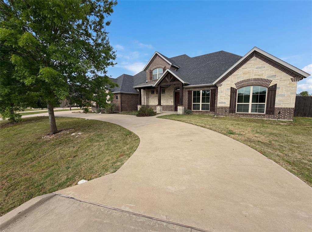 6411 Caliche Circle Midlothian, TX 76065 - Photo 26 of 26 a front view of a house with a yard
