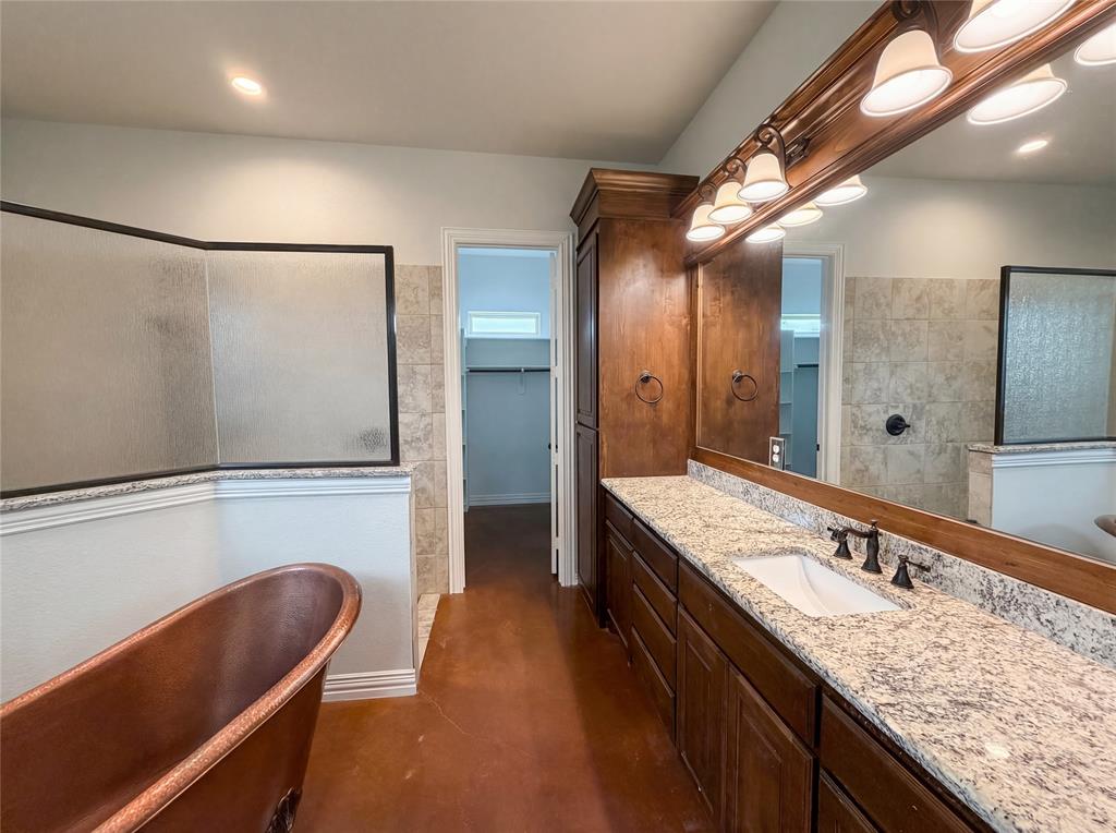 6411 Caliche Circle Midlothian, TX 76065 - Photo 8 of 26 a bathroom with a granite countertop sink a toilet a mirror and bathtub