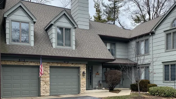 a front view of a house with garage