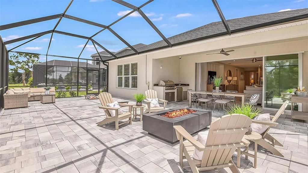33320 Castaway Loop Wesley Chapel, FL 33543 - Photo 3 of 23 a outdoor space with lots of tables and chairs