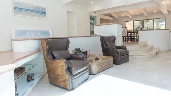 a view of a dining room with furniture window and outside view