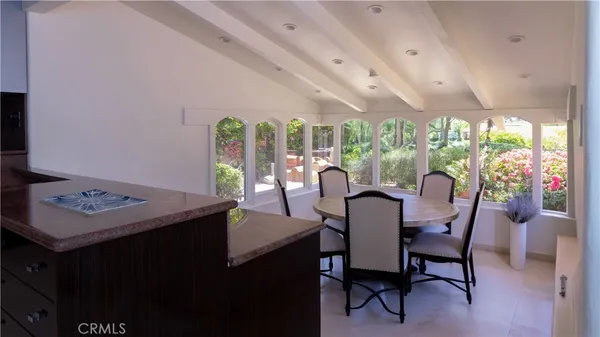 a kitchen with stainless steel appliances granite countertop a sink a stove and cabinets