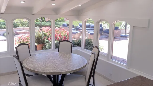 a kitchen with sink refrigerator and window