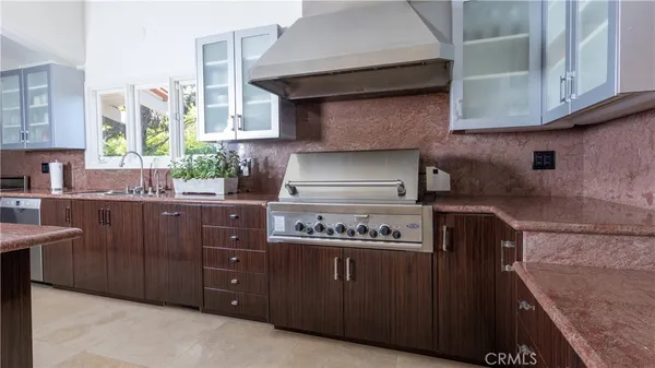 a kitchen with a refrigerator and cabinets