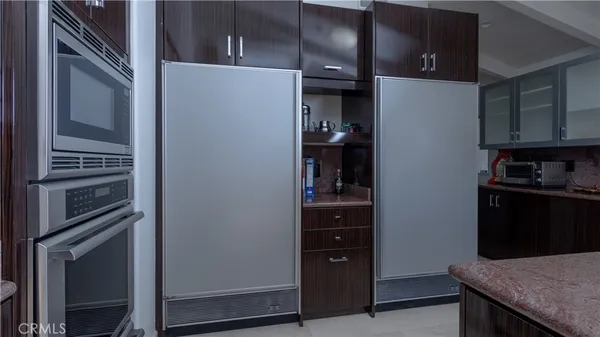 a bed room with a bed and a large window