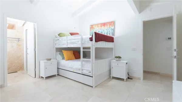 a bathroom with a granite countertop sink a mirror and a shower