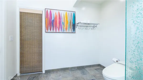 a view of a backyard with couches table and chairs