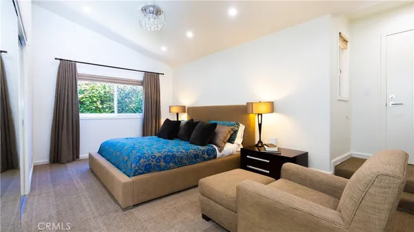 a view of a patio with couches and potted plants