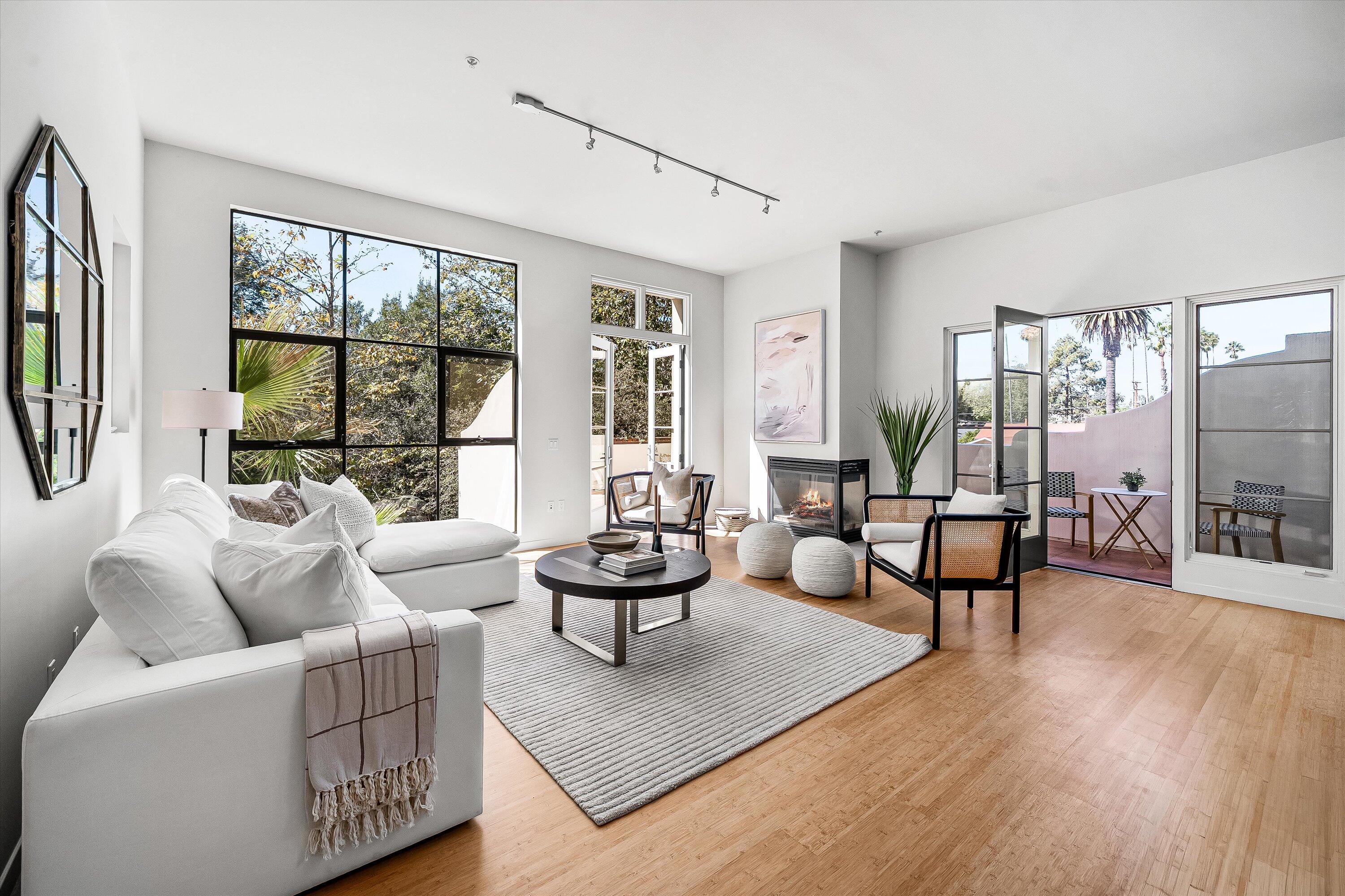 401 Chapala Street, Unit 214 Santa Barbara, CA 93101 - Photo 11 of 31 a living room with furniture and a large window