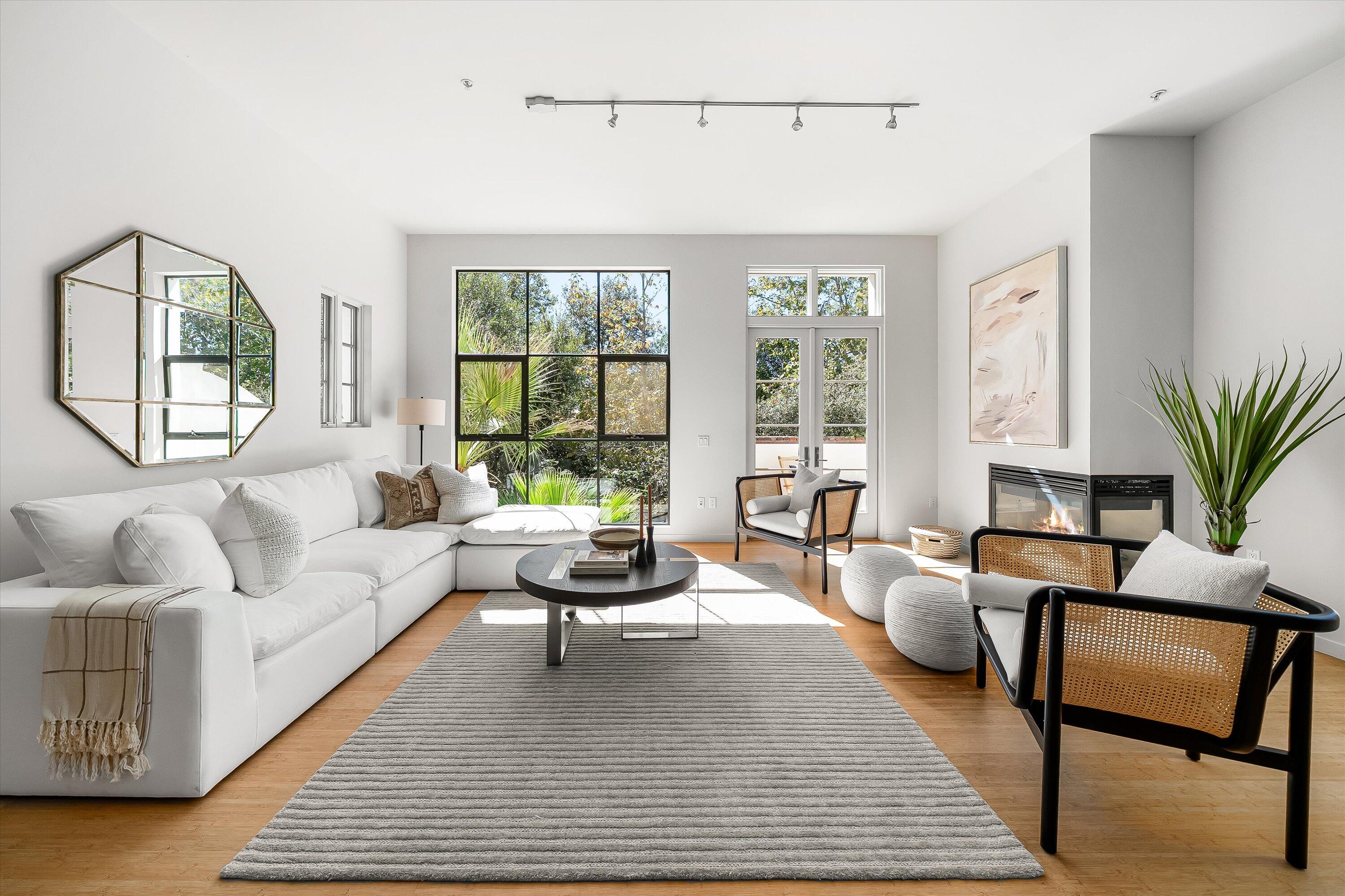 401 Chapala Street, Unit 214 Santa Barbara, CA 93101 - Photo 12 of 31 a living room with furniture and a large window
