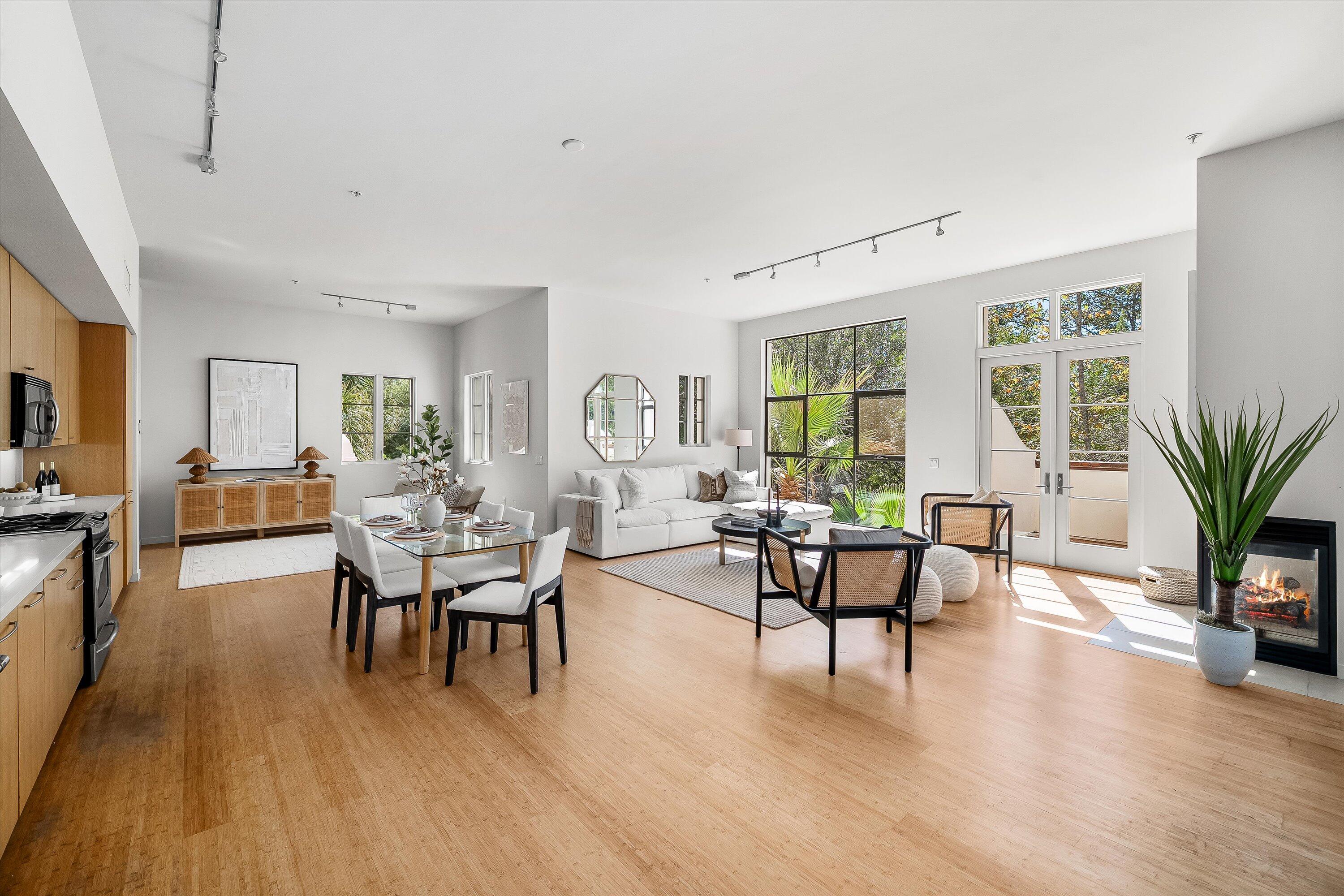 401 Chapala Street, Unit 214 Santa Barbara, CA 93101 - Photo 14 of 31 a living room with furniture floor to ceiling window and wooden floor