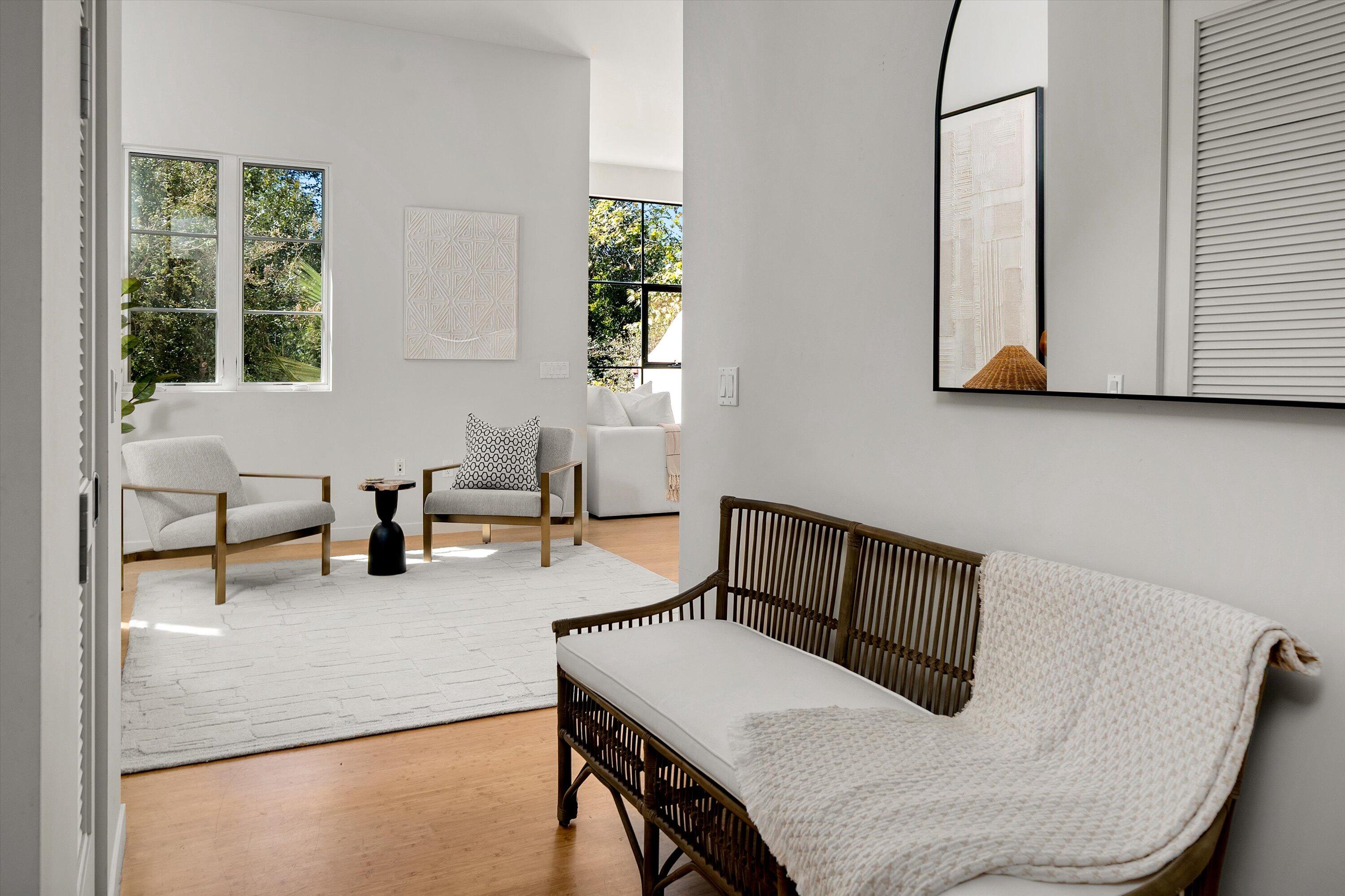 401 Chapala Street, Unit 214 Santa Barbara, CA 93101 - Photo 7 of 31 a living room with furniture and a window