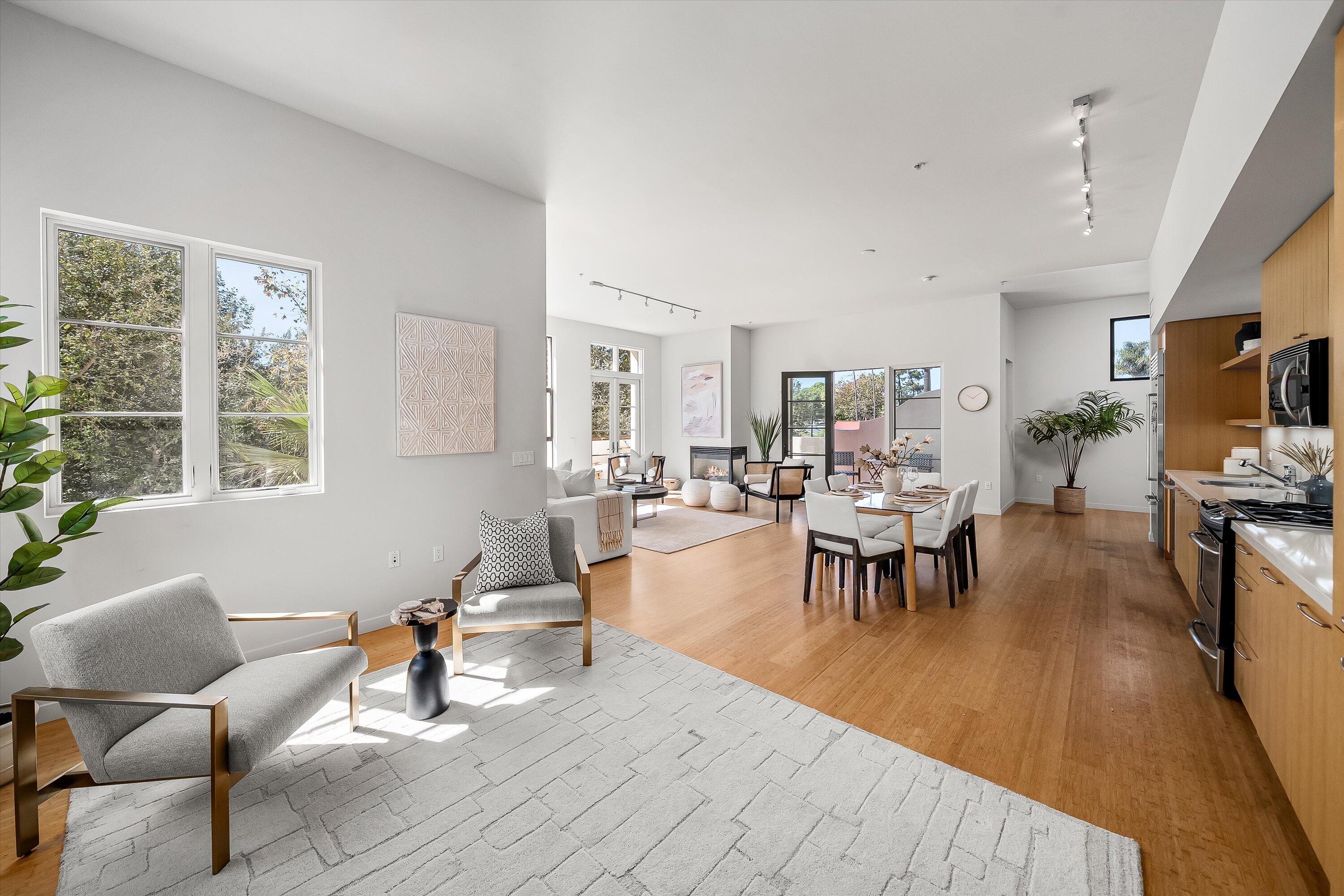 401 Chapala Street, Unit 214 Santa Barbara, CA 93101 - Photo 10 of 31 a living room with furniture and a flat screen tv