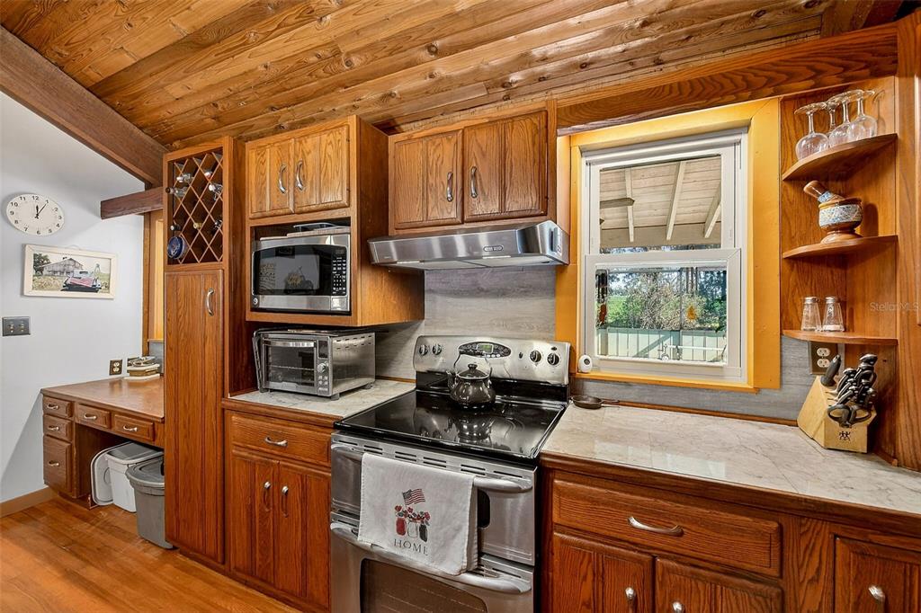 2635 North Dover Road Dover, FL 33527 - Photo 18 of 84 a kitchen with stainless steel appliances granite countertop a stove and a sink