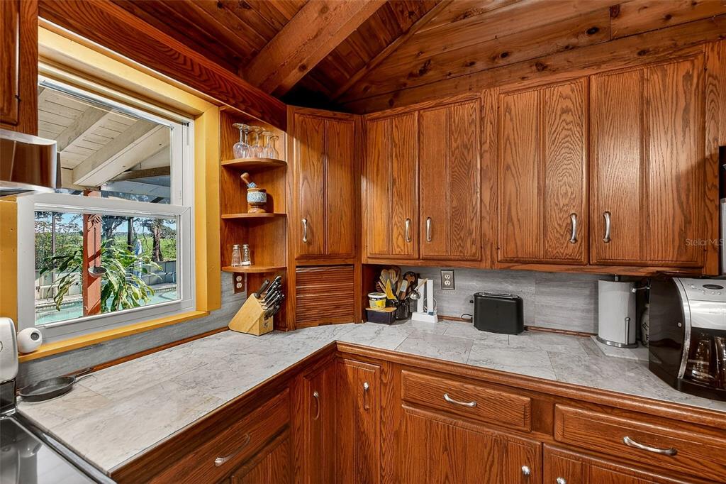 2635 North Dover Road Dover, FL 33527 - Photo 19 of 84 a kitchen with stainless steel appliances granite countertop a sink window and cabinets