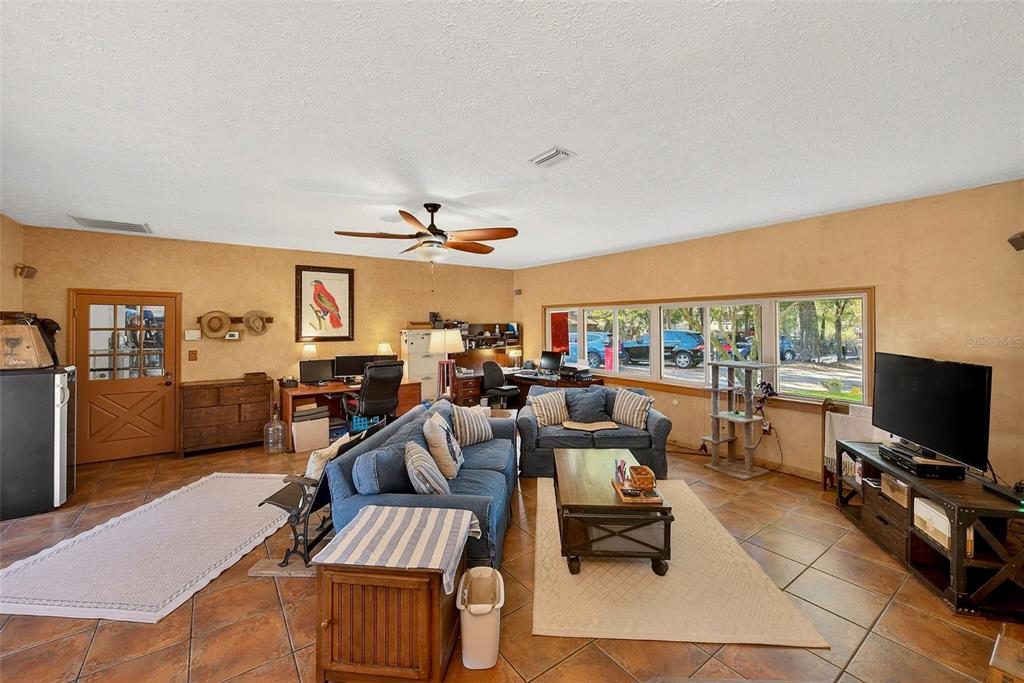 2635 North Dover Road Dover, FL 33527 - Photo 27 of 84 a living room with furniture and a flat screen tv