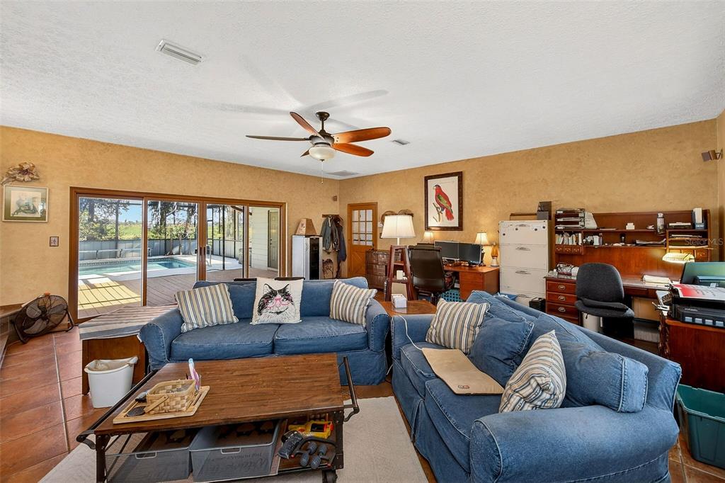 2635 North Dover Road Dover, FL 33527 - Photo 30 of 84 a living room with furniture a ceiling fan and a window