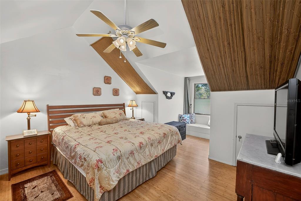 2635 North Dover Road Dover, FL 33527 - Photo 41 of 84 a bedroom with a bed and a flat tv screen on dresser