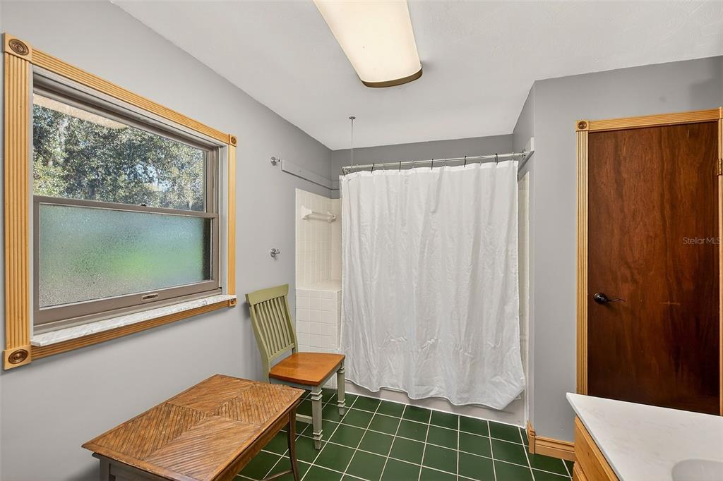 2635 North Dover Road Dover, FL 33527 - Photo 44 of 84 a bathroom with a window and a shower