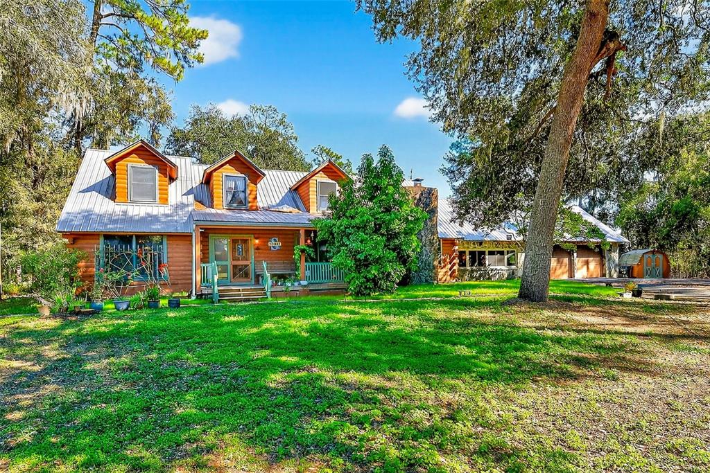 2635 North Dover Road Dover, FL 33527 - Photo 59 of 84 a front view of a house with a garden
