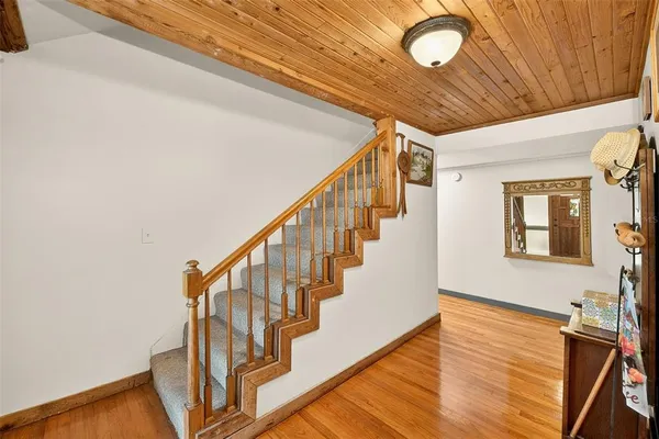 a view of a hallway with furniture