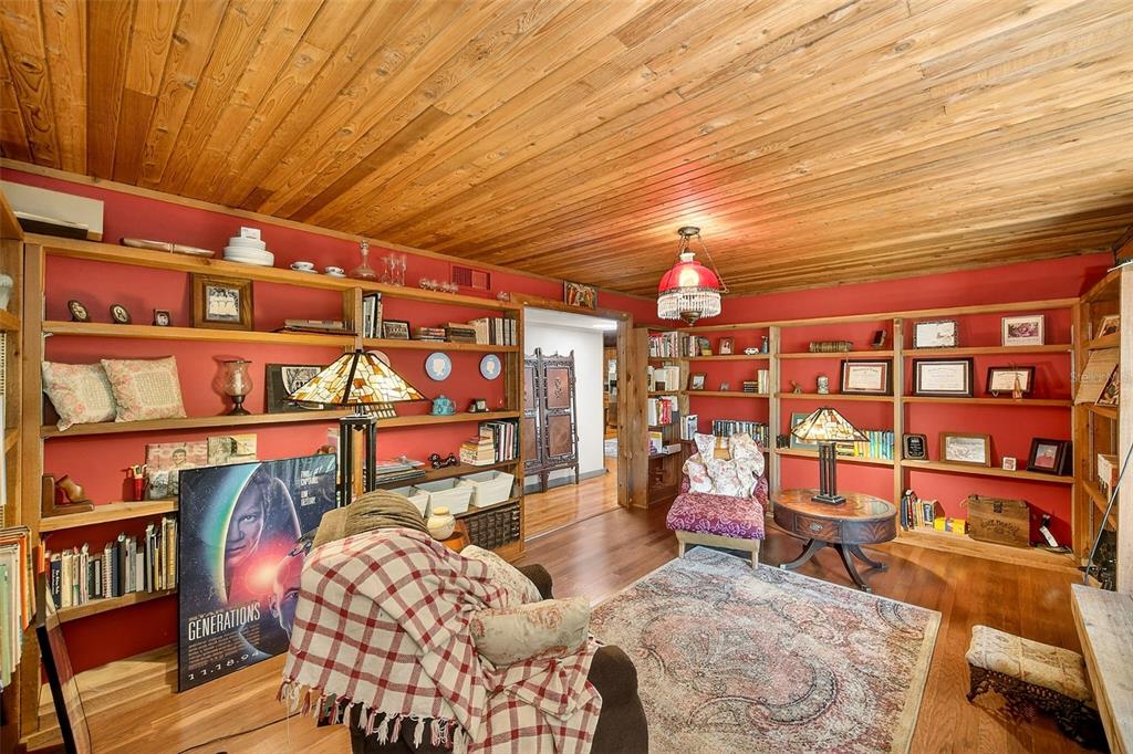 2635 North Dover Road Dover, FL 33527 - Photo 10 of 84 a bedroom with furniture and a book shelf