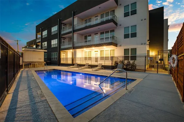 a view of swimming pool with chairs