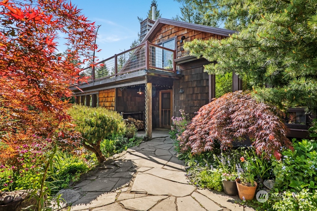 a front view of a house with garden
