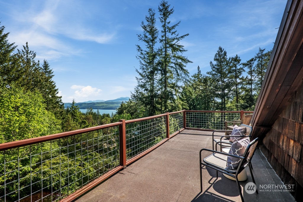 5610 Cape George Road Port Townsend, WA 98368 - Photo 21 of 37 a view of a two chairs in the balcony
