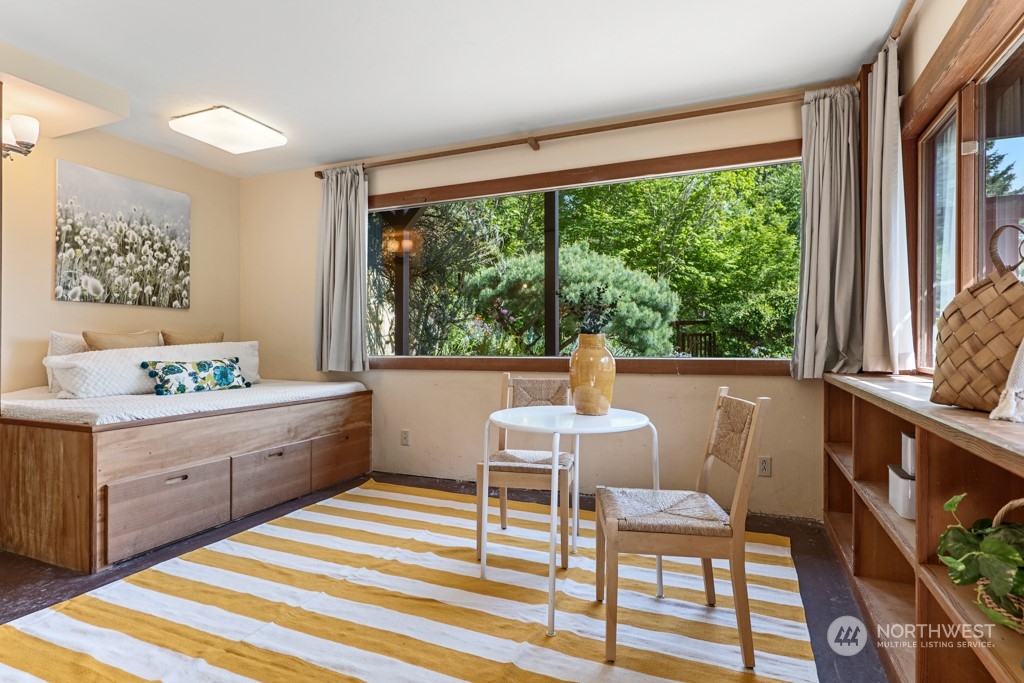 5610 Cape George Road Port Townsend, WA 98368 - Photo 22 of 37 a room with a bed and large windows