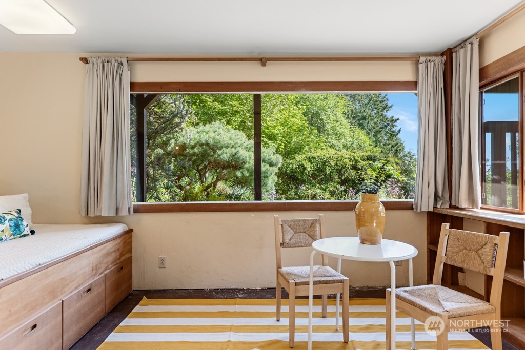 5610 Cape George Road Port Townsend, WA 98368 - Photo 23 of 37 a view of a dining room with furniture window and wooden floor