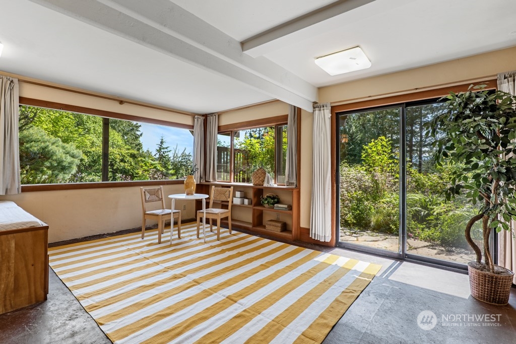 5610 Cape George Road Port Townsend, WA 98368 - Photo 24 of 37 a living room with large windows