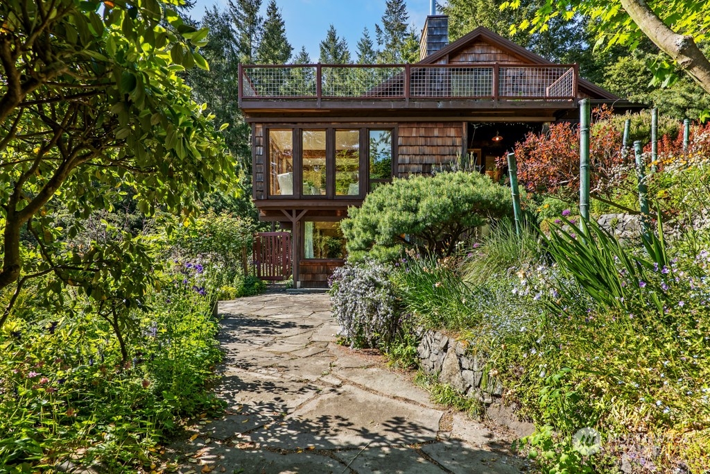 5610 Cape George Road Port Townsend, WA 98368 - Photo 28 of 37 a front view of a house with garden