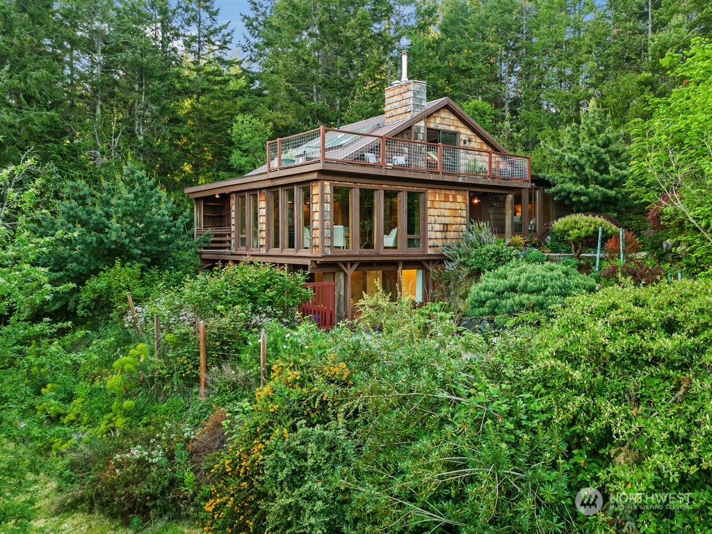 5610 Cape George Road Port Townsend, WA 98368 - Photo 32 of 37 a front view of a house with a yard