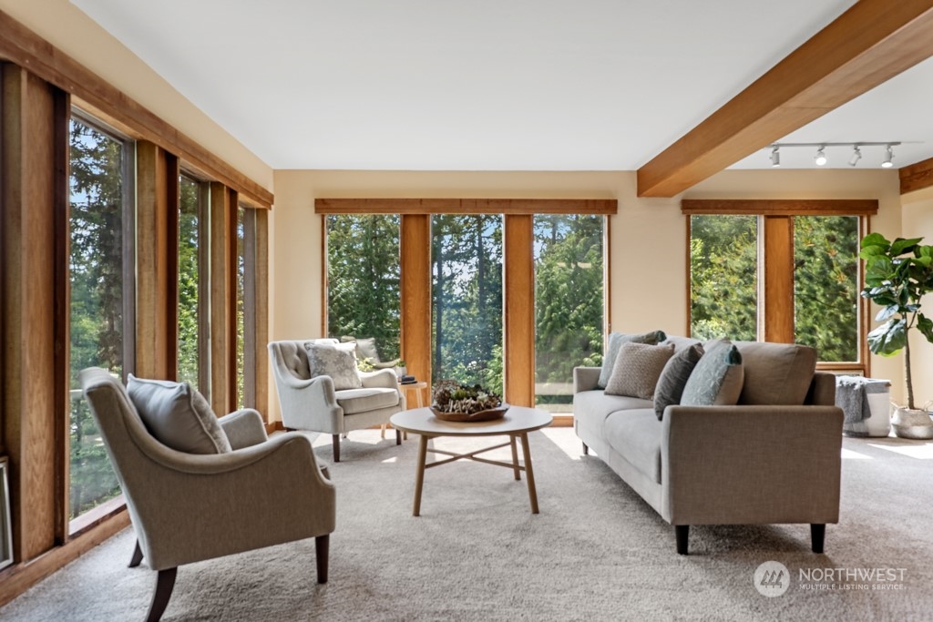 5610 Cape George Road Port Townsend, WA 98368 - Photo 4 of 37 a living room with furniture and a large window