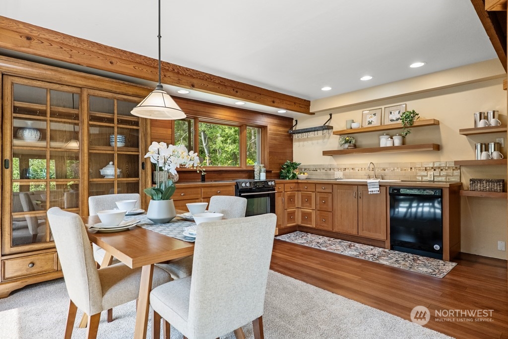 5610 Cape George Road Port Townsend, WA 98368 - Photo 7 of 37 a dining hall with stainless steel appliances granite countertop a stove and a sink