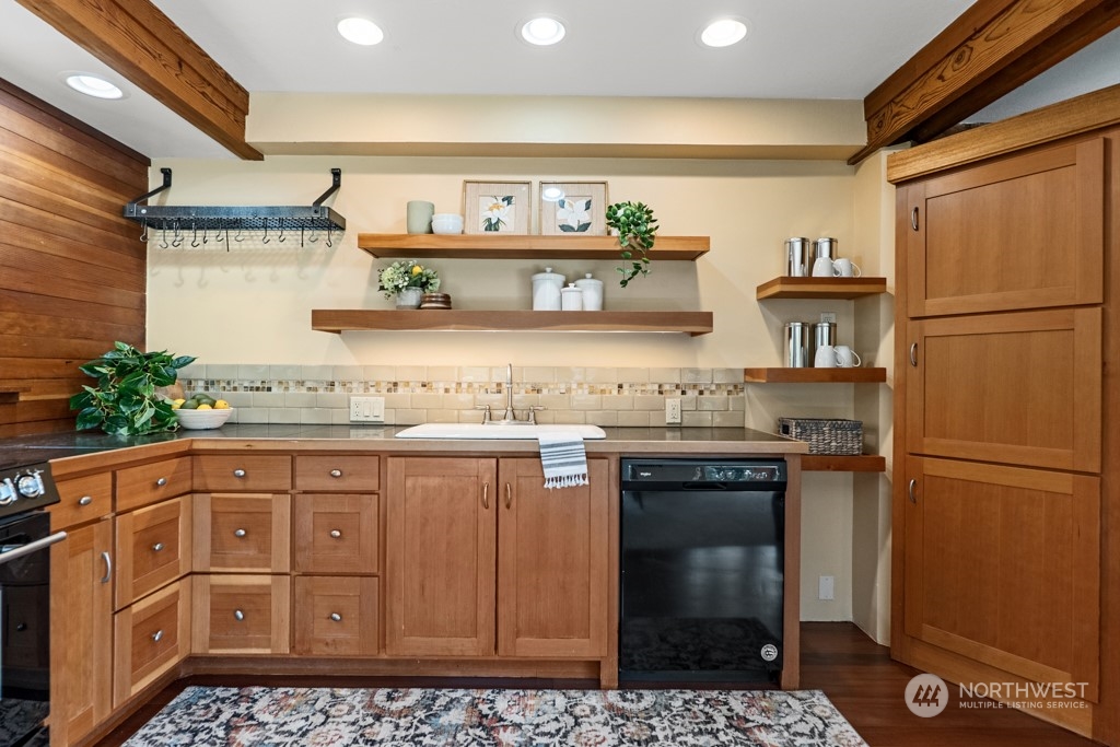 5610 Cape George Road Port Townsend, WA 98368 - Photo 9 of 37 a kitchen with stainless steel appliances granite countertop a refrigerator and a stove