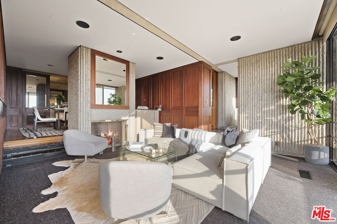 407 Upper Mesa Road Santa Monica, CA 90402 - Photo 19 of 54 a living room with furniture and a large window