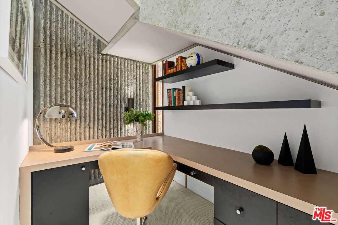 407 Upper Mesa Road Santa Monica, CA 90402 - Photo 32 of 54 a dining room with table chairs and a potted plant