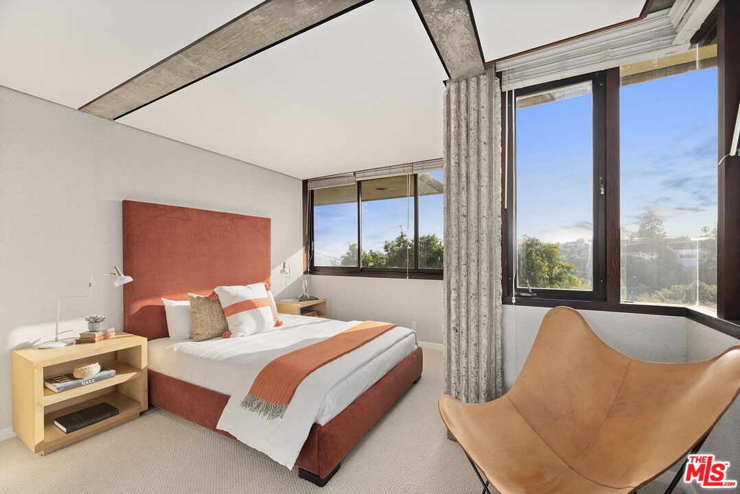 407 Upper Mesa Road Santa Monica, CA 90402 - Photo 33 of 54 a bedroom with a bed and a window