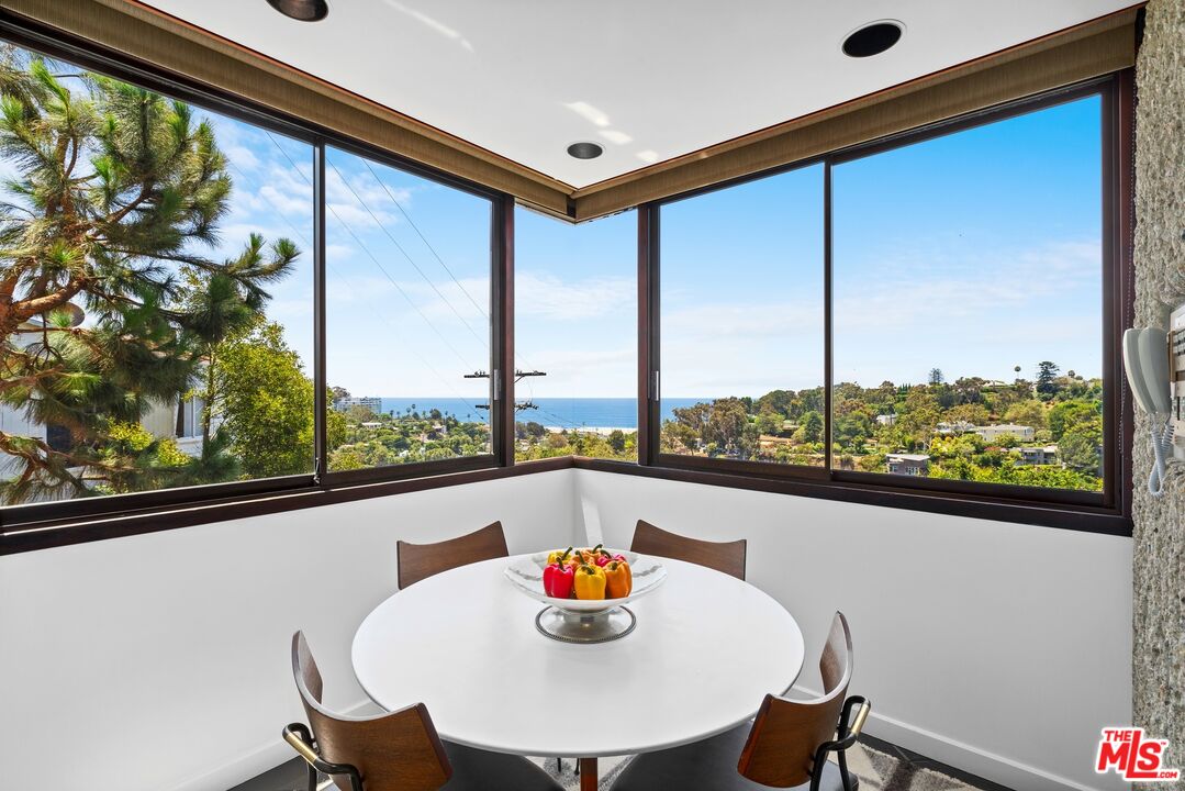 407 Upper Mesa Road Santa Monica, CA 90402 - Photo 35 of 54 a view of a dining room with furniture window and outside view