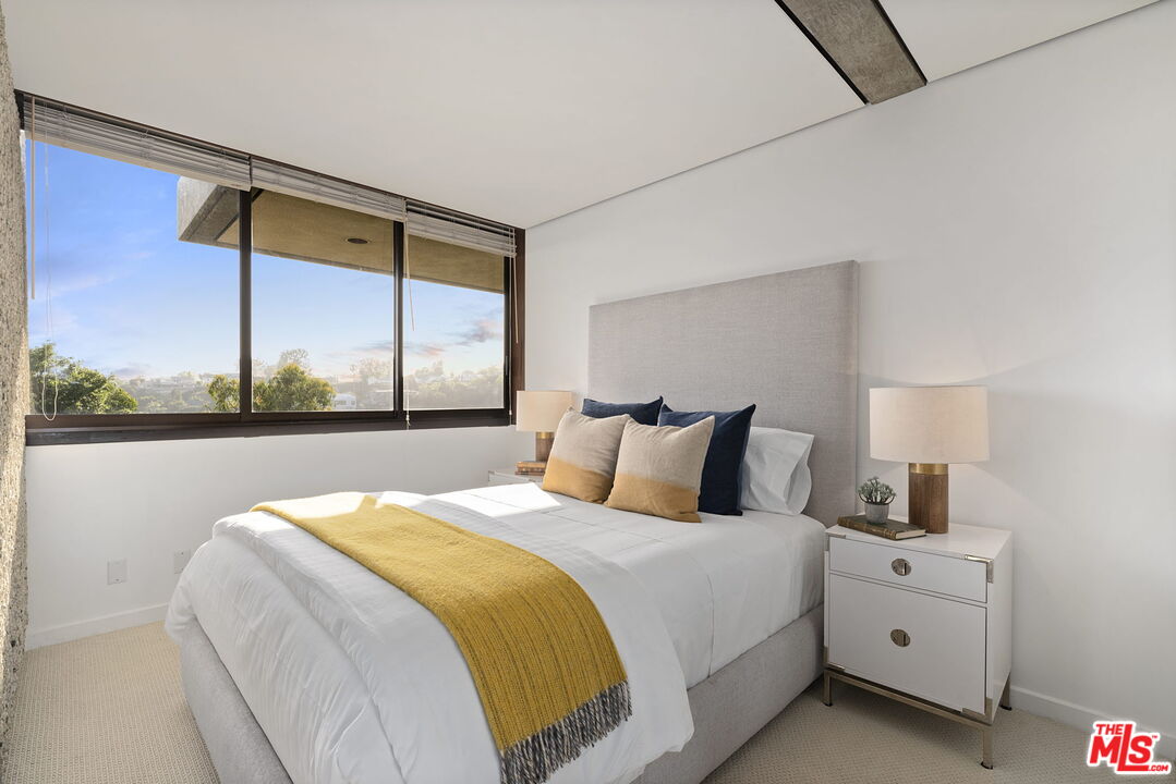 407 Upper Mesa Road Santa Monica, CA 90402 - Photo 39 of 54 a bedroom with a bed and a window