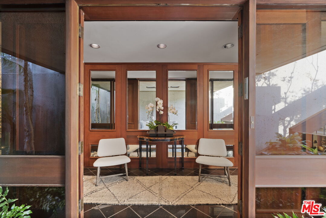 407 Upper Mesa Road Santa Monica, CA 90402 - Photo 48 of 54 a living room with furniture and a large window