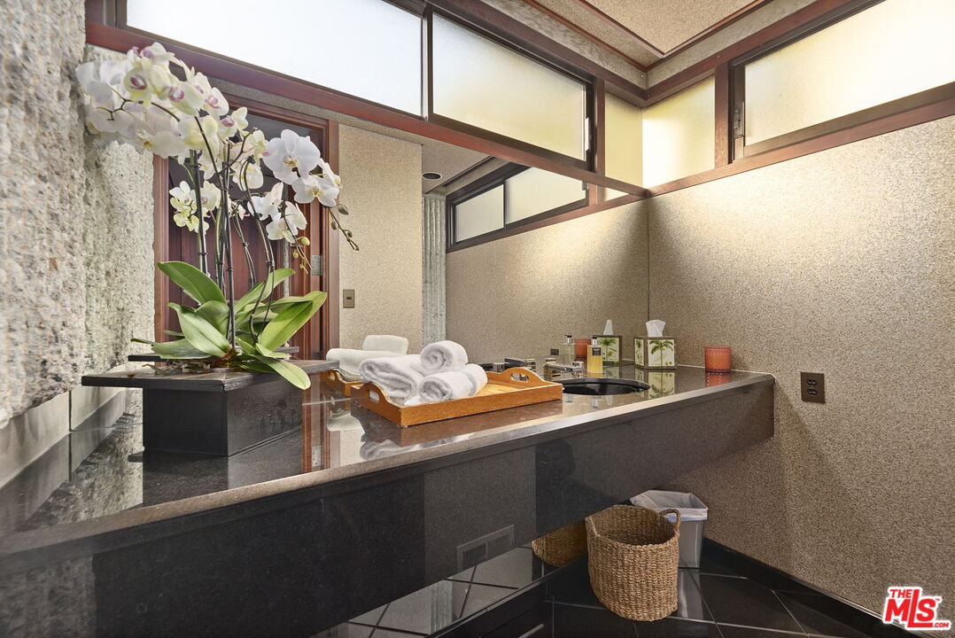 407 Upper Mesa Road Santa Monica, CA 90402 - Photo 50 of 54 a dining room with table and chairs