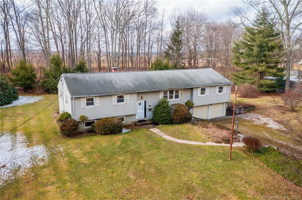 16 Vining Road Bethel, CT 06801 - Photo 1 of 1 a backyard of a house with table and chairs