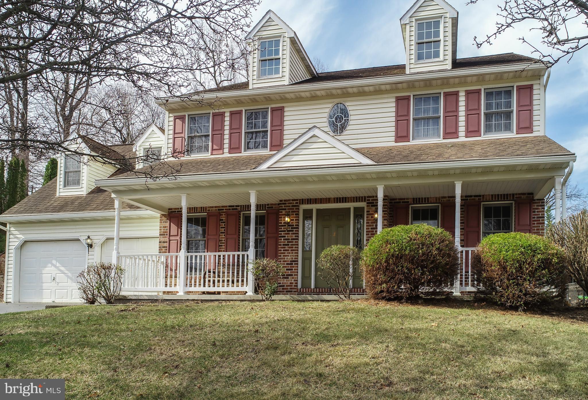 592 Wolfe Lane Mohnton, PA 19540 - Photo 1 of 31 a front view of a house with a garden
