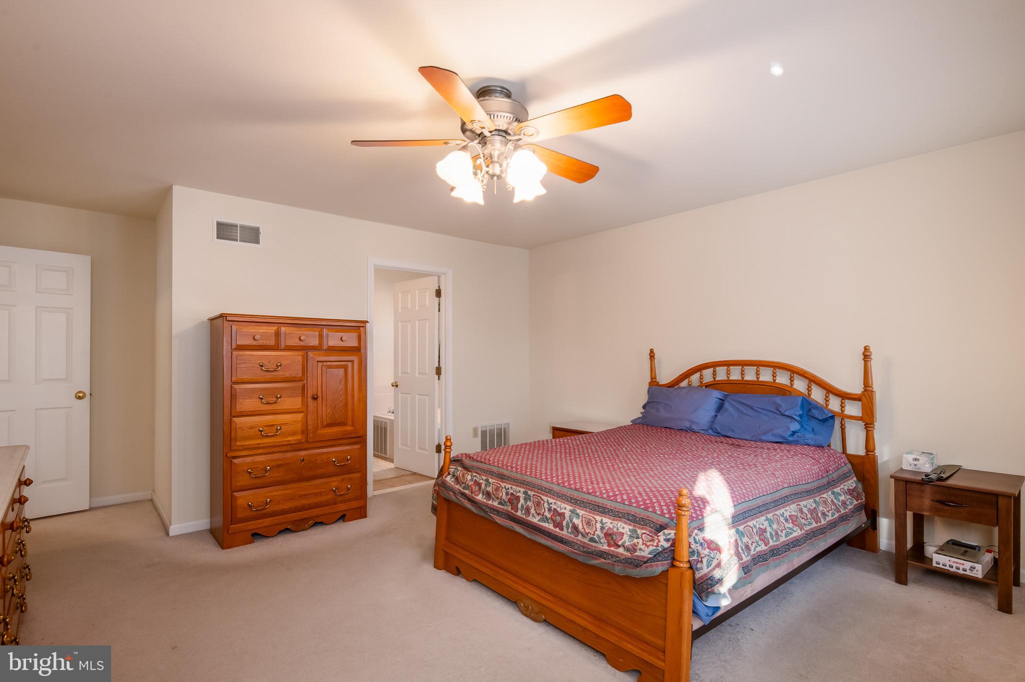 592 Wolfe Lane Mohnton, PA 19540 - Photo 16 of 31 a bedroom with a bed and a chandelier
